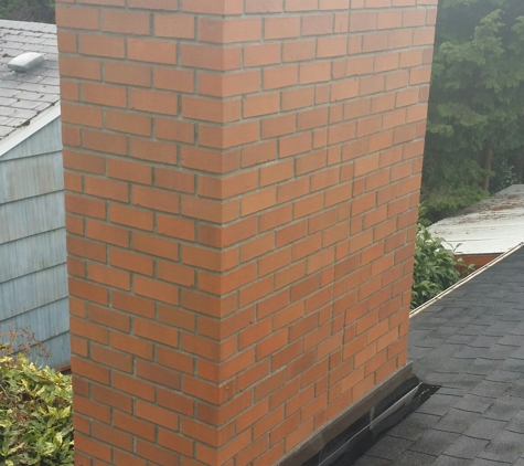 Bazia Masonry - Kent, WA. Brick Chimney. Full demo to the roofline and fully rebuilt with Brick. New flashing, new flue liners and crown concrete cap. Bazia masonry