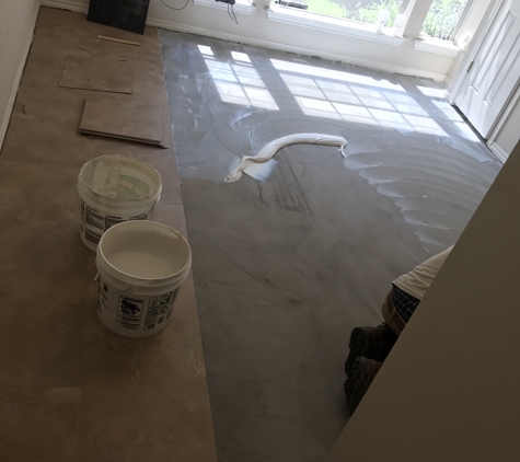 Zavala Flooring Service - Austin, TX. Glue spread out before install