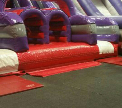 BounceU - Roseville, CA. Climbing wall with obstacles and slide