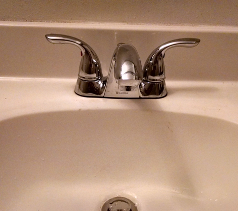 Bob Hunter Plumbing & Heating Company. New faucet in the bathroom.