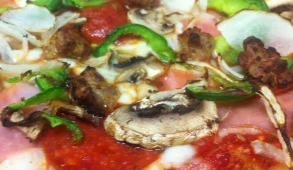 Spanky's Pizza & Restaurant - Fremont, MI. Fresh Veggies sliced daily for our pizzas! This is our deluxe pizza!