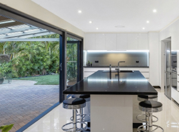 Bradnam's Windows & Doors - Urraween, QLD. Black Aluminium Bi-Fold Doors