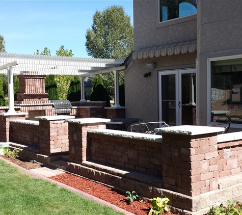 Decorative Landscape Borders - Golden, CO. Raised paver patio