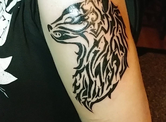 Exploited Tattoo - Fox Lake, IL. Tribal Wolf tattoo done by Jim Hovel