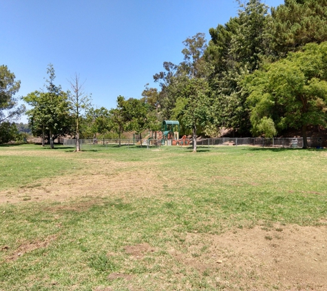 Briarwood Park - Los Angeles, CA. Grassy area and playground.