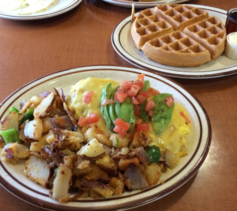 Country Gables Cafe - Roseville, CA. California omelette: bacon, avocado, cheese, tomato and hollidaise  sauce