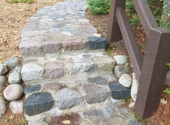 State Line Landscaping & Construction. Split stone walk and stairway