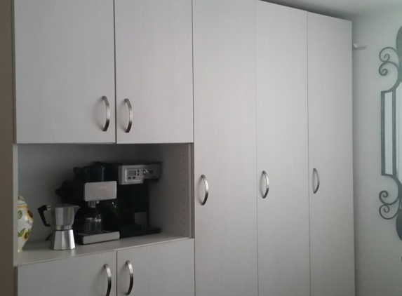 Milian Frame - Fort Lauderdale, FL. Great clean  kitchen storage, and a little coffee bar!