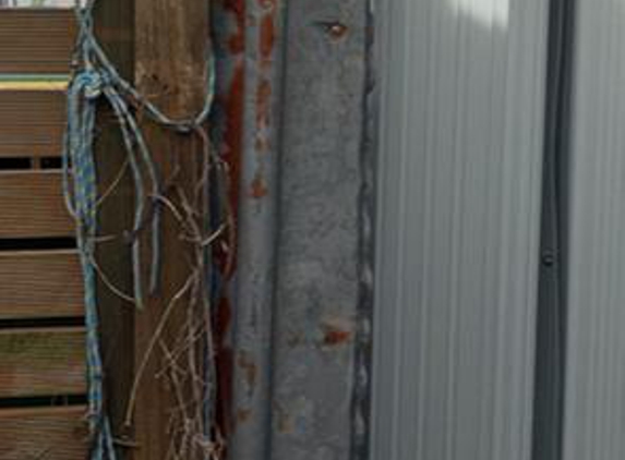 Atomic Fencing - Terrigal, NSW. Photo shows gap filled by scrap metal (by me, not them) so that my dog couldn't get out again.