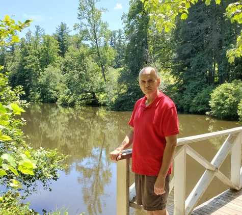 Carl Sandburg Home National Historical Site - Flat Rock, NC. Bill Lewis of Vero Beach, Florida, spending a quiet afternoon walking the trails of the Carl Sandburg Home in Flat Rock, North Carolina.