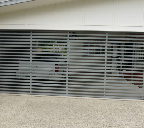 Noosa Door Centre. Tilt door manufactured from aluminium and powder coated.