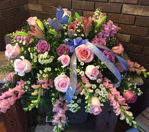 Flowers by Evelyn - Gaylord, MI. A beautiful memorial spray for a mom and grandma