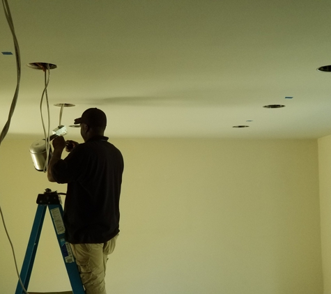 Buzz Electric - Dearborn, MI. Recessed can installation in living room.