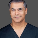 Millin Budev, M.D.